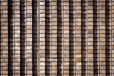 Background of old brown lined brick wall texture, abstract architecture wallpaper.