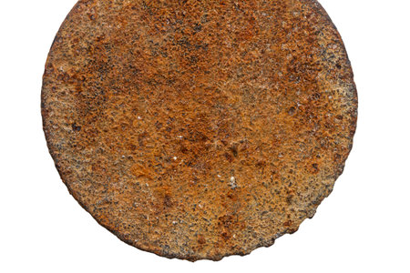 A piece of rusty metal isolated on a white background.の写真素材