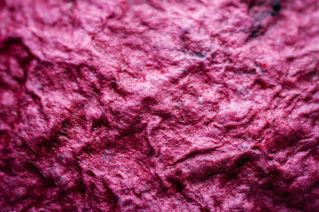 Extreme close up of purple handmade paper clay with a structure and rough texture. Paper recycling. Selective soft focus, shallow depth of field.の写真素材