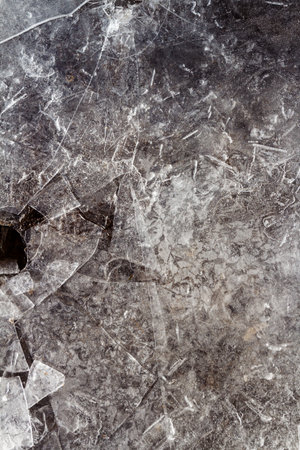 Winter ice background. Frozen water texture, macro view. Frost river close up, top view. Ice on flowing river.の写真素材