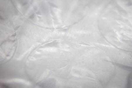 Extreme macro of plastic bubble wrap texture. Selective soft focus, shallow depth of field. Abstract dreamy backgroundの写真素材
