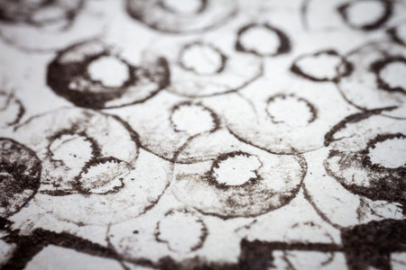 Extreme close up of black acrylic paint texture on paper. Selective focus.の写真素材