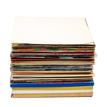 Stack of vintage vinyl records isolated on white background. Collection of old music LPs. Pile of...