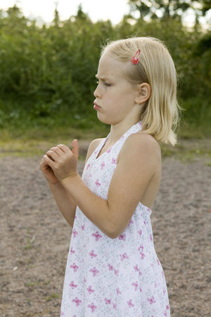 pretty girl stayng on the beach with tree on the background.の写真素材