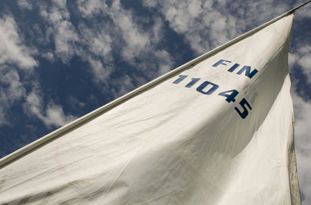 Yacht sail and blue cloudless aky above
