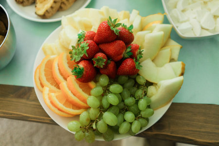 Fruit salad on a white plate. Fresh fruit salad on a white plate.の写真素材