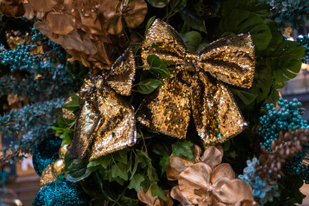 Christmas tree decoration with golden bows and ornaments, close upの写真素材