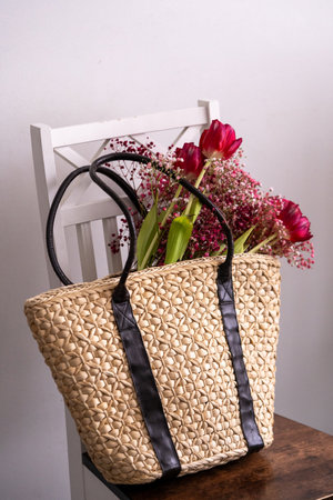 Wicker basket with flowers.の写真素材