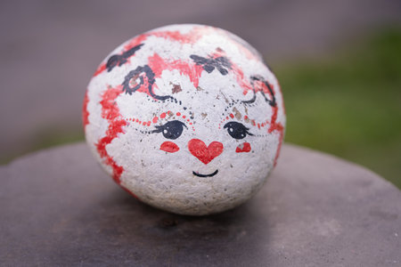 Ceramic ball with a smile in the form of a heart