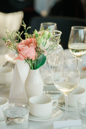 Wedding table setting with cutlery, glasses and crockery