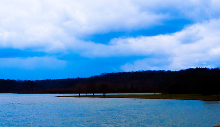 Bright blue sky over a beautiful lake.の写真素材