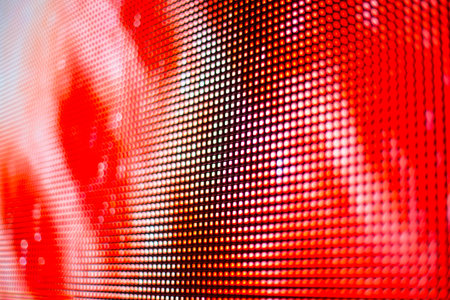 Bright red with white dots smd LED screen close up backgroundの写真素材