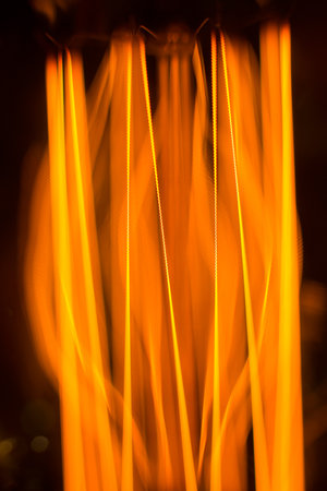Warm glow of the threads of filament cob lamp - macro backgroundの写真素材