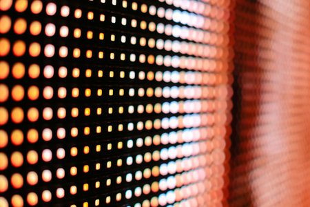 Bright colored yellow and orange LED smd screen - close up backgroundの写真素材
