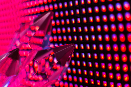 Bright colored stone crystals on the LED wall background  - close-up macro photo