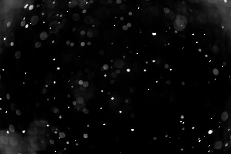 Snow hi-res texture for designers works - abstract photo texture of the real snow on the black background for adding and editing as background layer in the screen regimeの写真素材