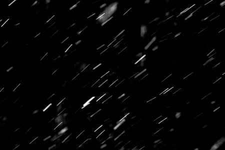 Snow hi-res texture for designers works - abstract photo texture of the real snow on the black background for adding and editing as background layer in the screen regimeの写真素材