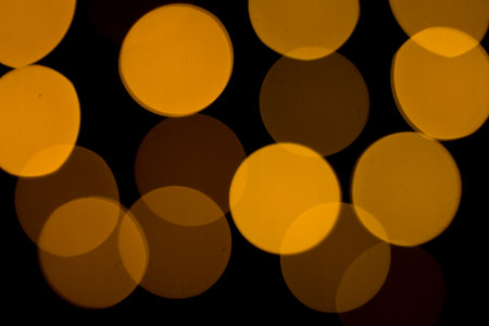 Colored bokeh textures - abstract photo on the black background for adding and editing as the background layer in the multiply regimeの写真素材