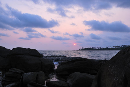 Sunset on the horizon with rocks and sea, Thailandの写真素材