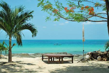 Two beach chairs and white umbrella on perfect tropical beach, samed Island, Thailandの写真素材