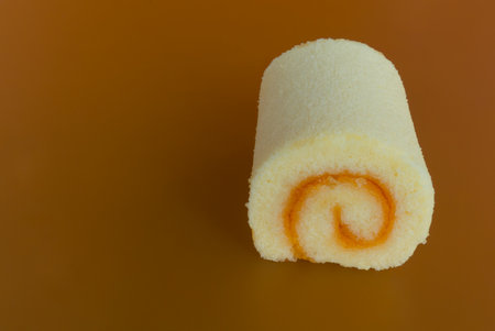 sweet cakes on the orange backgroundの写真素材