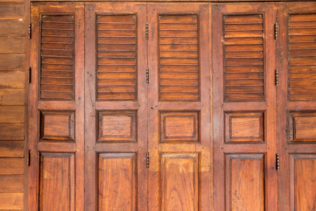 closed brown old style wooden door with windows,beautiful wood door  texture backgroundの写真素材