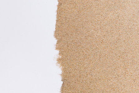 Closeup of a pile sand on white background.Summer holiday relax backgroundの写真素材