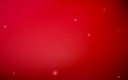 A vibrant red gradient background features subtle, glowing sparkles creating a soft, dreamy atmosphere.の写真素材