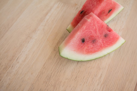Slices of watermelon on wooden desk background