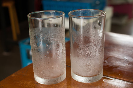 Close up of Empty glass with water droped.の写真素材