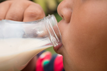 A boy with glass of milk, Drinking milk.の写真素材