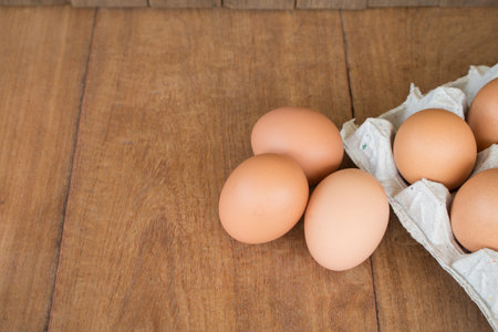 Fresh rural eggs on a wooden board