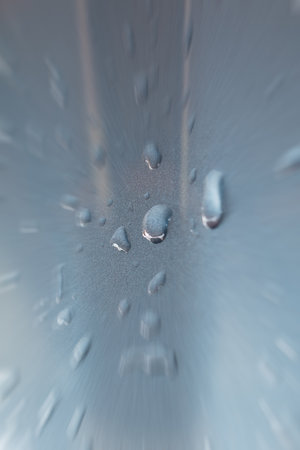 Water drops on blue metallic background.の写真素材