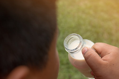 A boy with glass of milk, Drinking milk.の写真素材