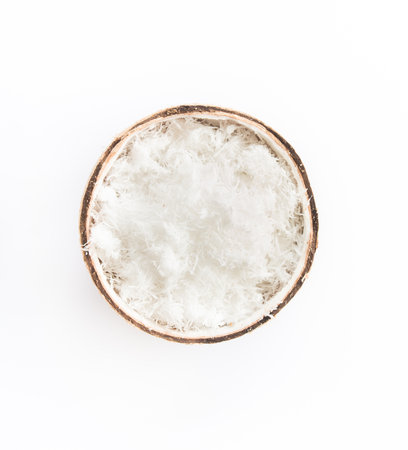 Close up of Freshly grated coconut in shell.の写真素材