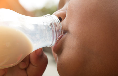 A boy with glass of milk, Drinking milk.の写真素材