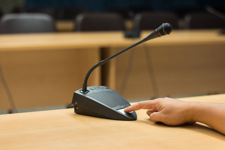 Soft focus of  microphones in conference room.