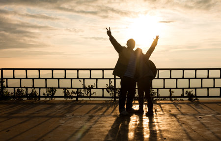 Silhouette of traveler over beautiful sunset background.の写真素材