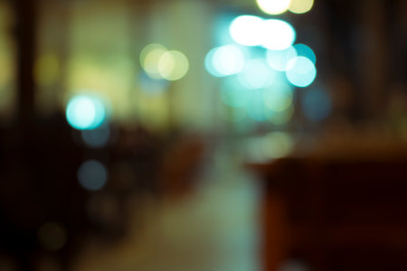 Defocused city night filtered bokeh abstract background.の写真素材