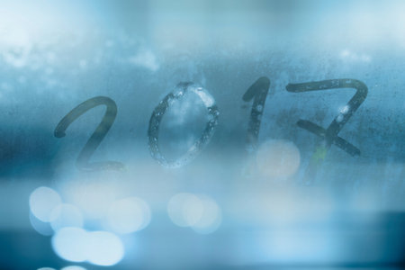 Blurred of glass with Happy new year 2017 for background.の写真素材