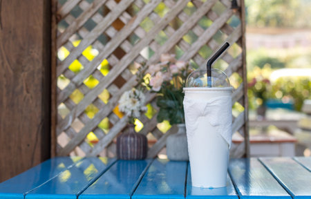 Close up of  drink cup on blue dining table set in food court.の写真素材