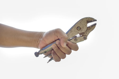 hand holding locking grip pliers on white background.の写真素材