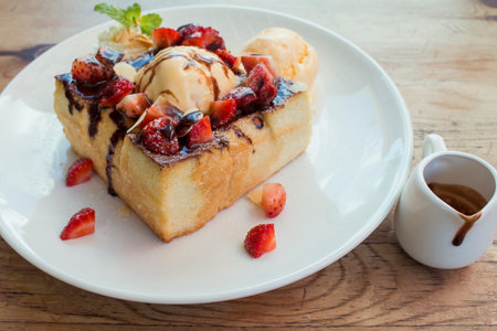 Toast Bread Pudding with ice cream and strawberry.の写真素材