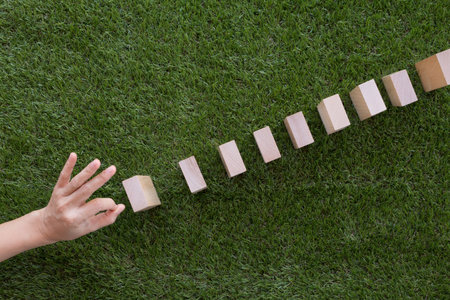 Hand playing domino effect.の写真素材