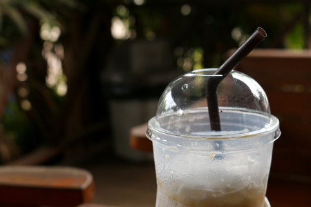 Glass of Cold Iced Coffee put on old table.の写真素材