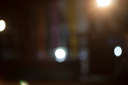 Defocused city night filtered bokeh abstract background.