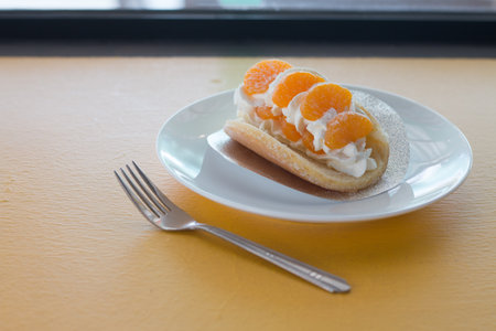 Orange topped on pancakes in coffee shop.の写真素材
