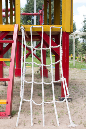 Playground with suspension bridge.