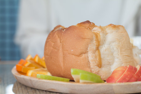 Closeup of toasted bread with fruit and honey.
