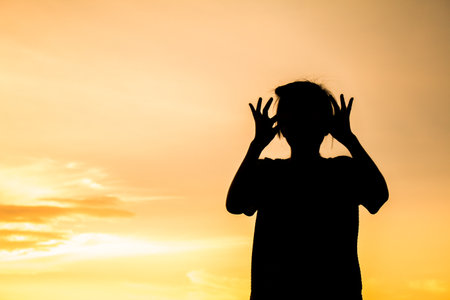 silhouette Boy screaming out shout action.の写真素材